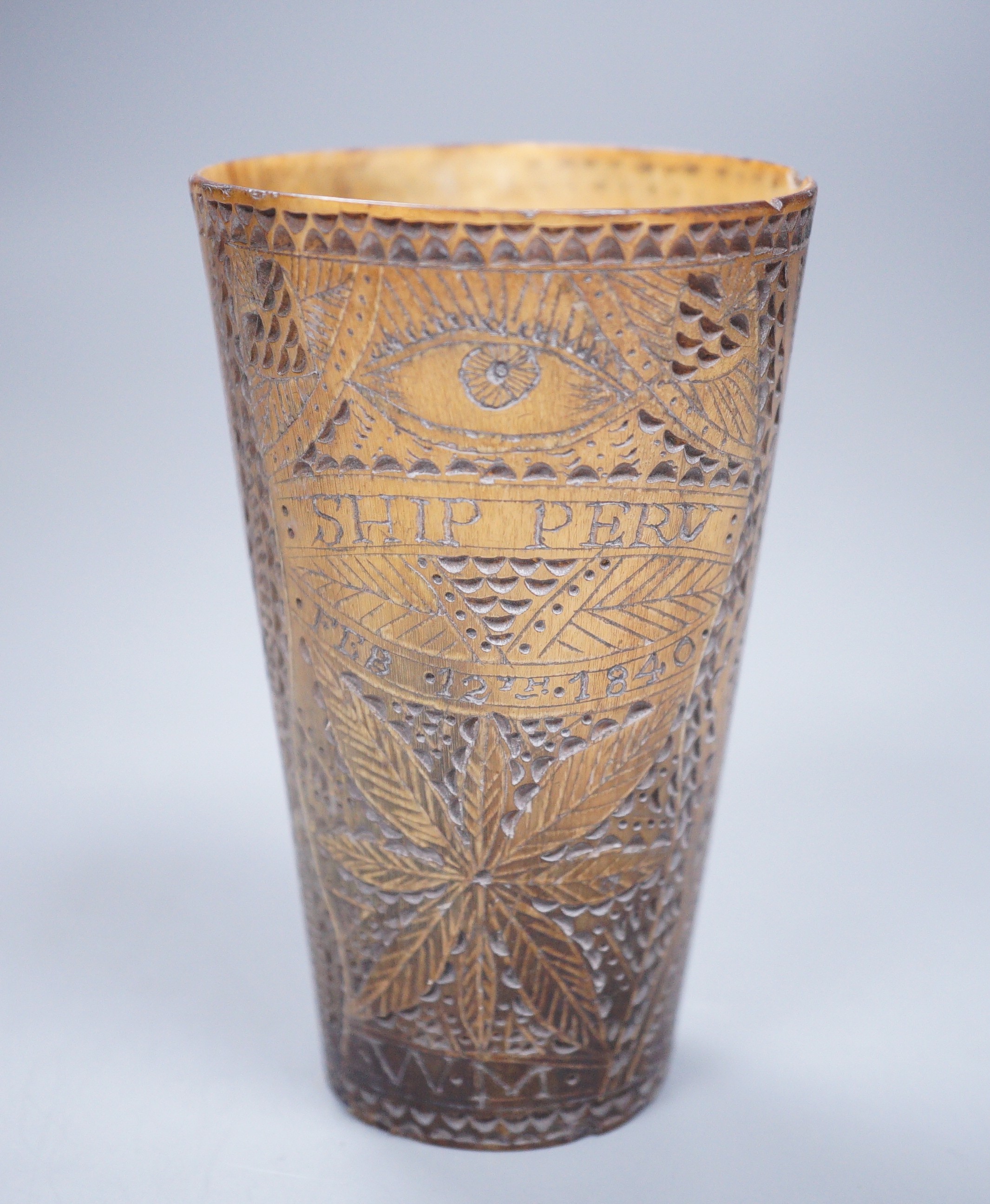 A 19th century carved horn beaker, titled ‘Ship Peru’, dated ‘Feb 12th 1840’, initialled ‘W.M’, the reverse carved ‘FOREVER TRUE ALWAYS YOURS’, height 10cm